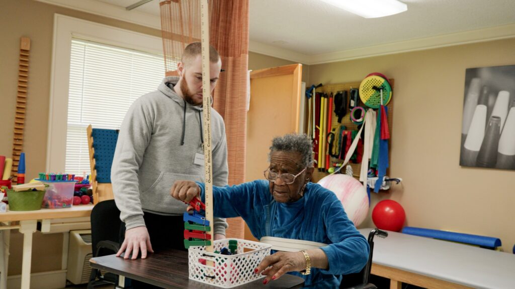 A woman goes through physical therapy for memory care